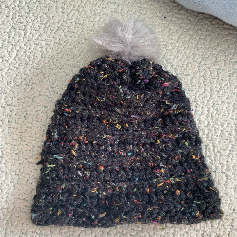 Hand knitted beanie with puff